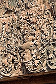 Banteay Srei temple - ancillary building of the causeway, Vishnou in the form of Narasimha holds upside-down Hiranya-Kasipu, the king of the Asuras